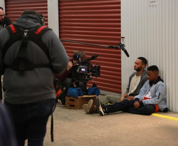 film crew shooting scene with two actors
