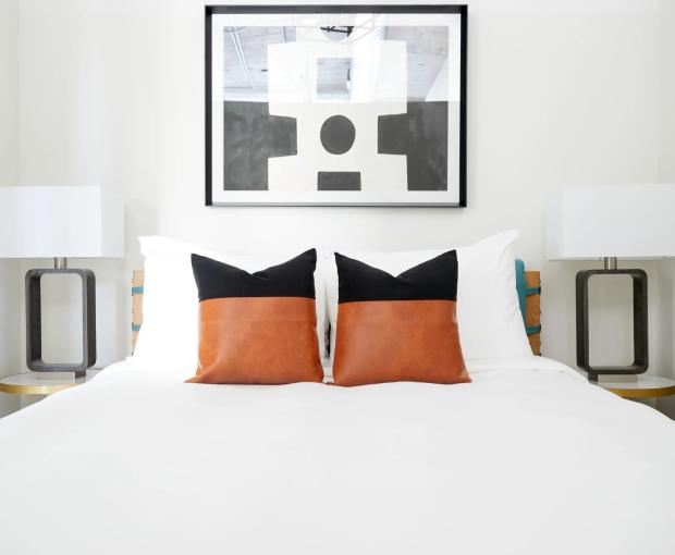 bed with orange pillows