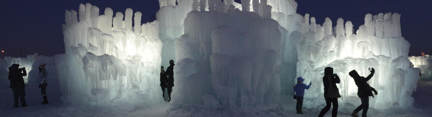 People standing in front of ice castles